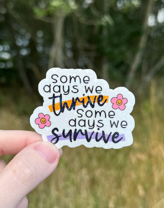 Some days we thrive some days we survive Holographic Sticker