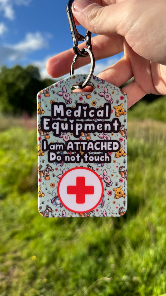Medical bag tag “medical equipment, I am attached, do not touch” (Pooh and friends print)