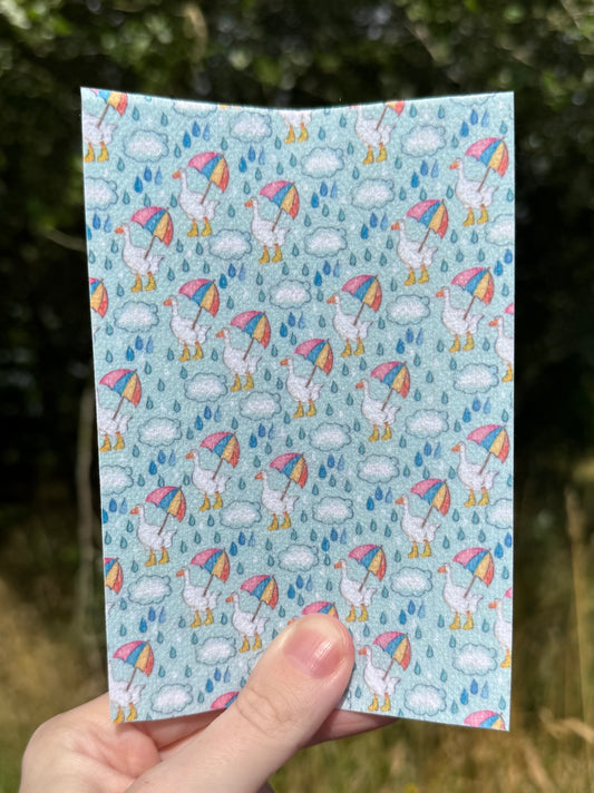 Dancing in the rain ducks with welly’s and rainbow umbrella tubie tape