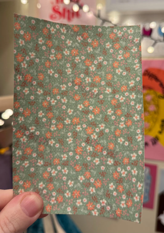 Dainty pink flowers on green Tubie tape