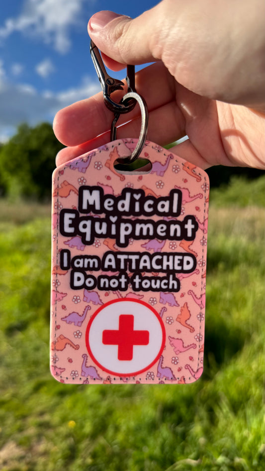 Medical bag tag “medical equipment, I am attached, do not touch” (pink Dino print)