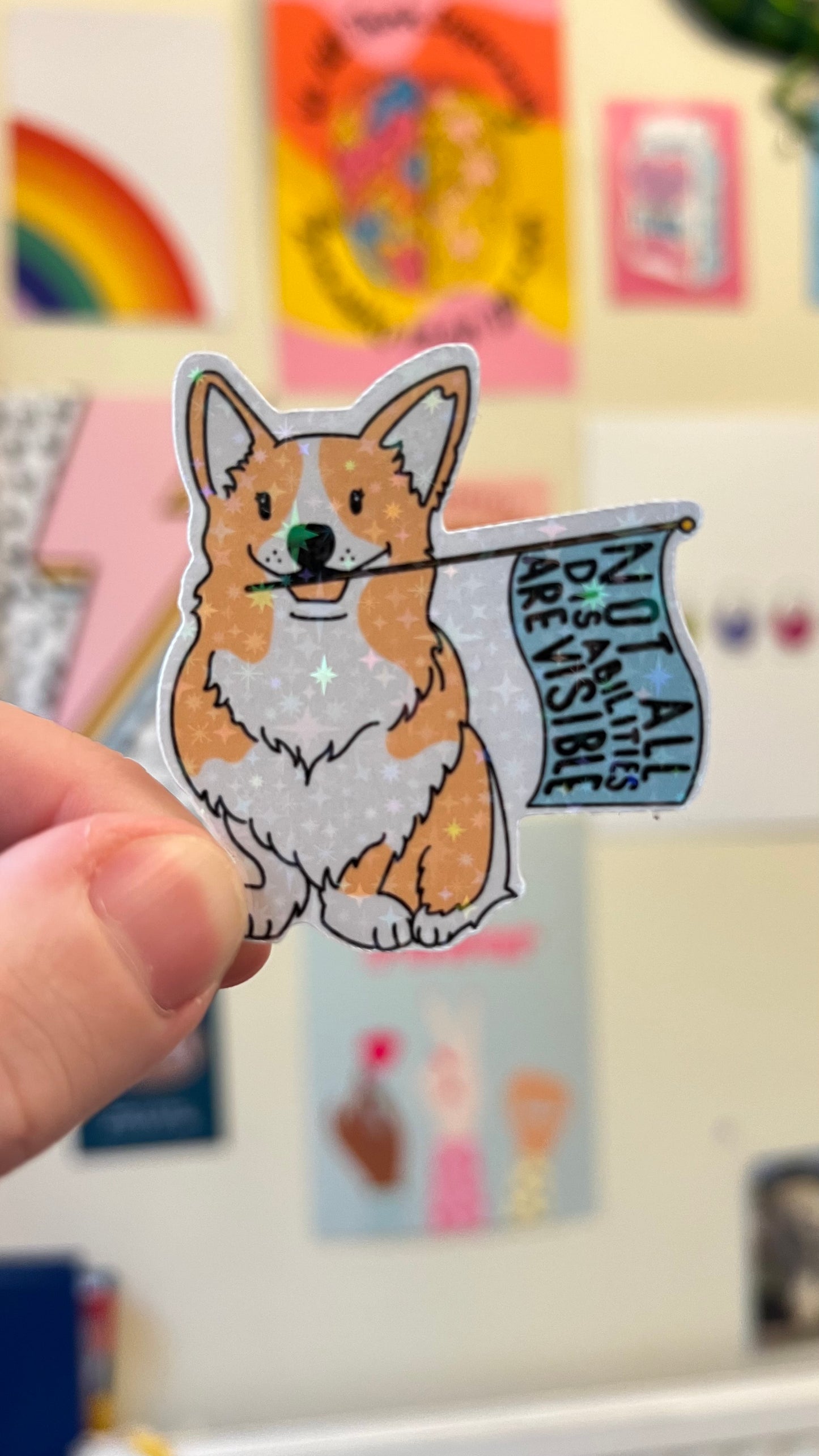 “Not all disabilities are visible” flag waving puppy holographic sticker