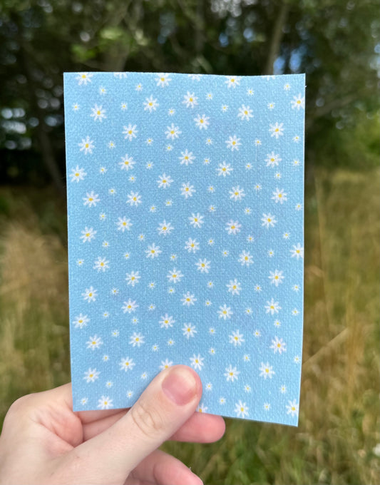 Little and big daisys on blue tubie tape