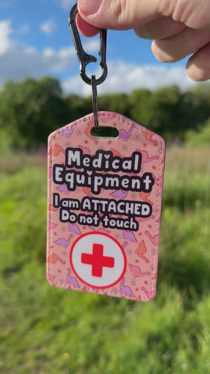 Medical bag tag “medical equipment, I am attached, do not touch” (pink Dino print)